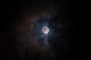 Naklejka na ściany i meble Full moon black background with clouds detail surface