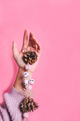 Christmas garland in a female hand