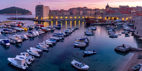 Fototapeta na wymiar Panoramic view of The Old Harbour and Fort St Ivana at sunset in Dubrovnik, Croatia