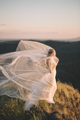 Fototapeta na wymiar Beautiful bride outdoors in a forest.