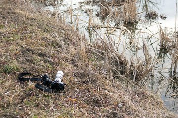 camera on the shore of the pond