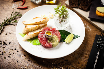 Tuna tartare served on a plate in restaurant