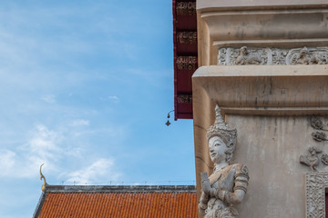 the angel stucco sculpture on the wall corner of the buddhist chapel temple
