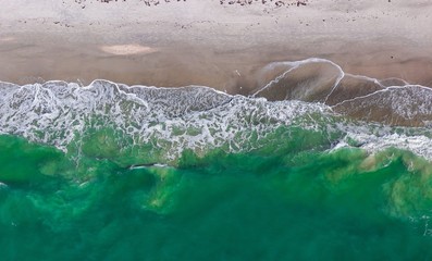 ocean wave on shore from above