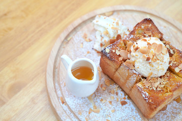 Honey toast topped with nuts and cups with honey