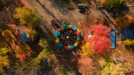 Autumn aerial photo of Ferris wheel landscape.