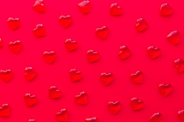 red background with hearts pattern, flat lay