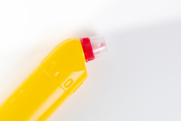 bottle with cleaning agent on white background. Top view