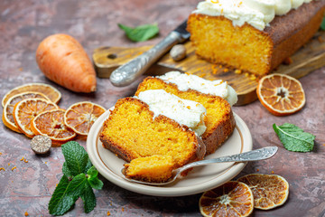 Slices of homemade carrot cake on a ceramic plate.