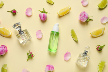 Flat lay composition with elegant perfumes on beige background