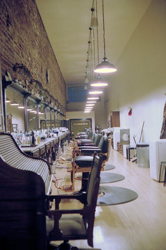 Row of chairs and mirrors in hair salon