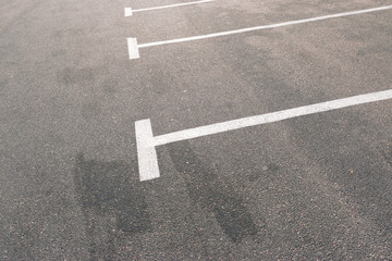 Road marking on asphalt with parking spots