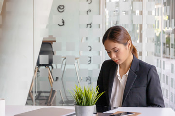 Businesswoman compare finance data on table.