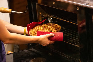 putting a pie in the oven