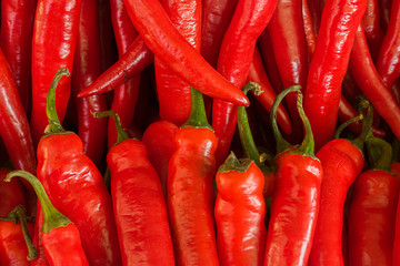 Red pepper for salad lies on the window of a market, store, supermarket