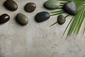 Obraz na płótnie Canvas Flat lay composition with stones on grey background, space for text. Zen concept