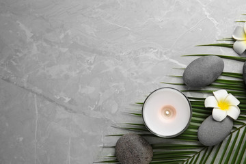 Flat lay composition with stones on grey marble background, space for text. Zen concept