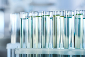 Test tubes with liquid samples for analysis in laboratory, closeup