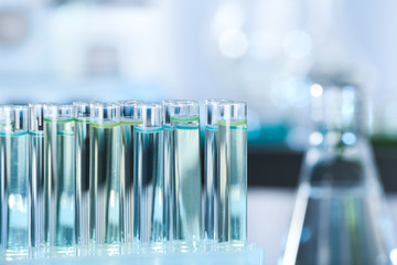 Test tubes with liquid samples for analysis in laboratory, closeup