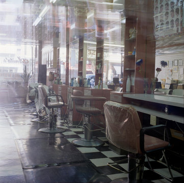 Row of pink salon chairs and mirrors, Mission District