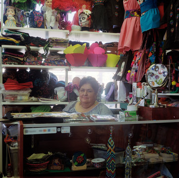Business owner behind counter in trinket store, San Francisco