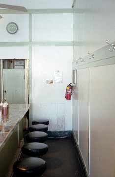Stools in front of small restaurant countertop