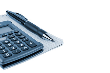 Automatic pen, calculator, notebook on a white background close-up.