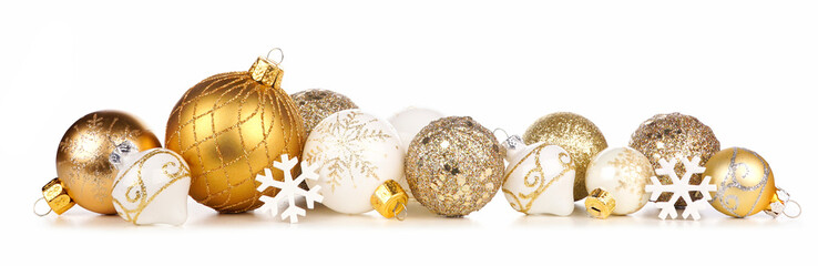 Christmas border of gold and white ornaments. Side view isolated on a white background.