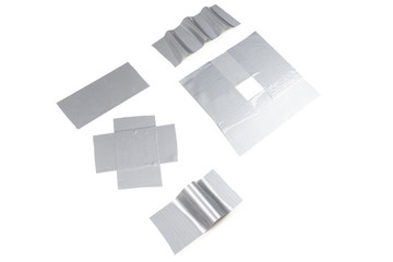 Silver scotch tape pieces isolated on white background.