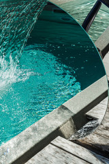 Waterfall. Water attraction in the pool. Hydromassage. Water massage. Relax. Aeration. Saturation...
