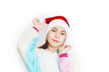 Young cute girl in Santa hat on white background. Festive Christmas background
