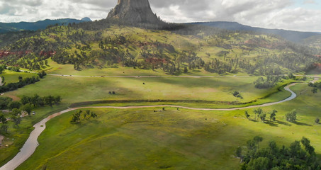 Aerial view of Devils Tower National Monument at summer sunset, Wyoming from drone perspective