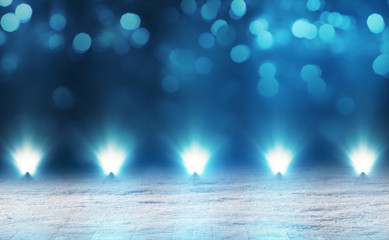Winter abstract, blurred background with bokeh. Blurry night city lights in reflection on a snowy...