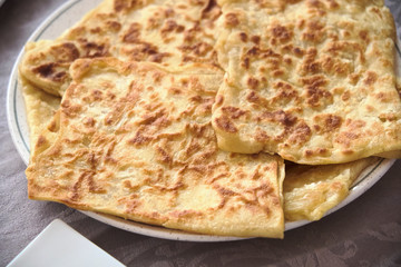 closeup of fresh baked Moroccan square pancakes called Rghaif or Msemen