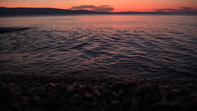 Scenic Sunset at the Beach Somewhere in Northern Croatia. Calm and Warm Adriatic Sea. Vacation Destination.