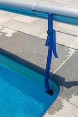 Naklejka premium Span for pool. Rolling coating. Pool protection. Rollete. Security. Pure water. Pool protection system.