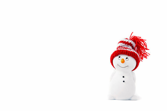 Happy snowman standing isolated on white background. Merry christmas and happy new year greeting card. Funny snowman in hat on snowy background. Copy space for text