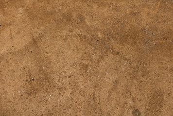 The surface of a dirty sandy floor, ground background