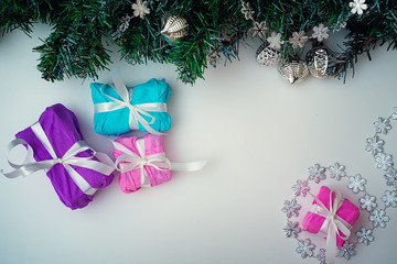 Christmas background. Christmas tree branch with holiday decorations on a white background. Background. Texture