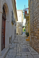 Venosa, Italy, 10/27/2019. A narrow street among the old houses of a medieval village