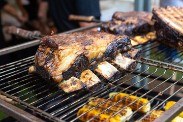 Closeup of delicious beef ribs slowly roasted on the barbecue grill, the Brazilian way. Selective focus. Concept of food, gastronomy, recipes, healthy eating and health.