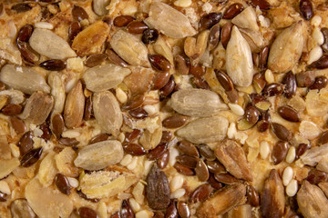 surface of cookies sprinkled with grains of sunflower, sesame and flax.