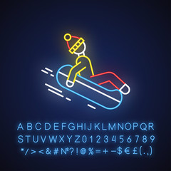 Snow tubing neon light icon. Winter extreme sport, risky activity and adventure. Person sliding, riding inflatable ring. Glowing sign with alphabet, numbers and symbols. Vector isolated illustration