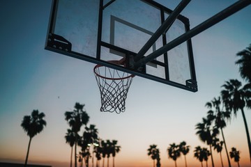 Basketball hoop on the beach at sunset © Calvin
