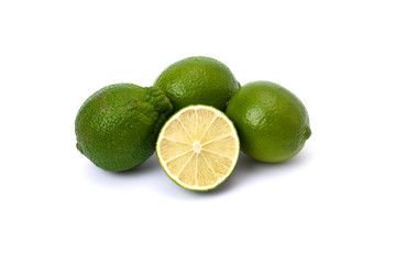 Lime green on a white background. Whole and halves limes isolated on white background. Full depth of field.