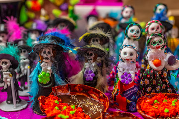 Glass and sequin sugar Calaveritas dolls, typical sweets during the time of the day of the dead in Mexico, toy offerings made with crumbs and icing sugar