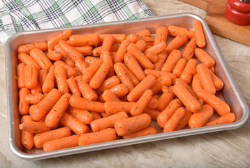 Baby carrots in a roasting pan