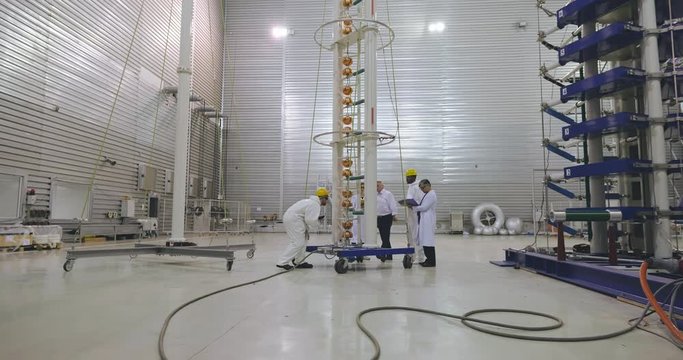 Team of research scientists work on a new generation equipment. Group of engineers prepare new equipment to tests and experiments