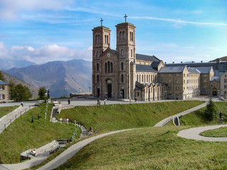 Fototapeta premium Shrine of Our Lady of La Salette between mountains French Alps. Sanctuary in the town of La Salette-Fallavaux in the Provence-Alpes-Côte d'Azur. Hautes-Alpes, France