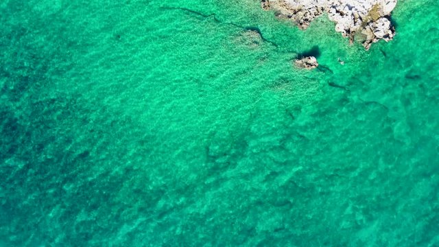 Aerial Footage of Turquoise Crystal Clear Water and the Rocky Shore. Northern Croatia, Europe.